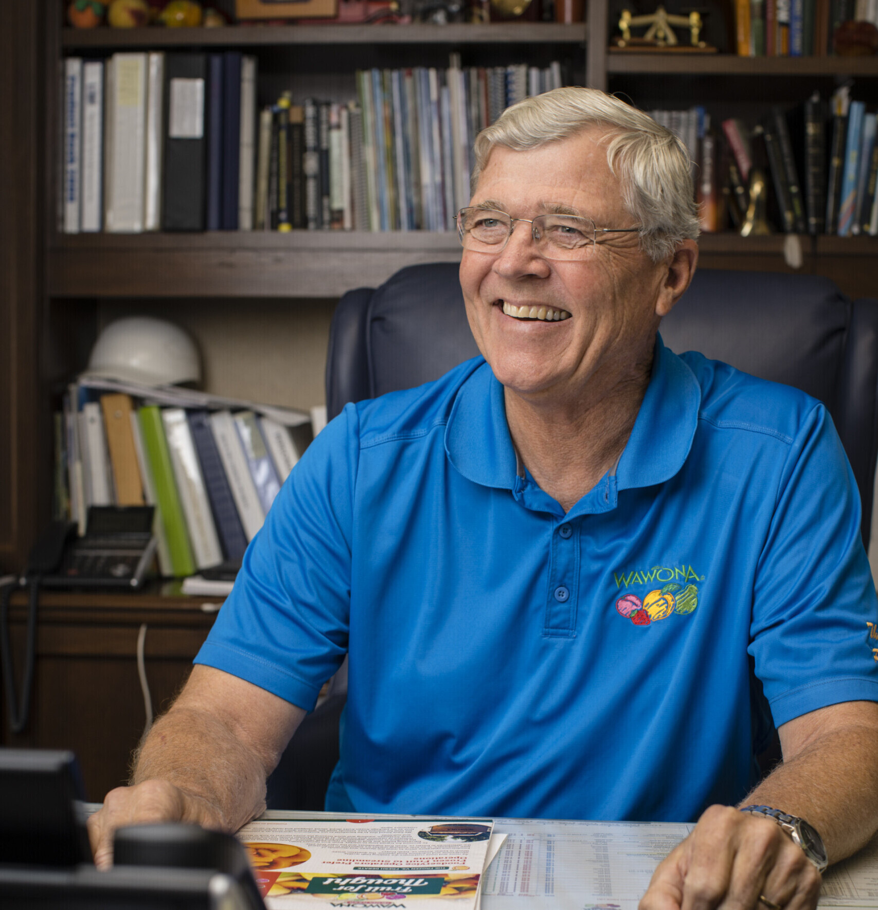 Bill Smittcamp, Wawona Frozen Foods owner, showcases family-run frozen fruit business in office.