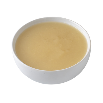 Creamy yellow dish in a white bowl, perfect for soups, sauces, or desserts.