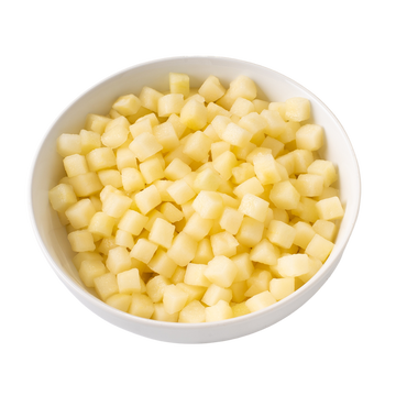 Diced yellow fruit in a bowl, fresh and healthy, perfect for salads and snacks.