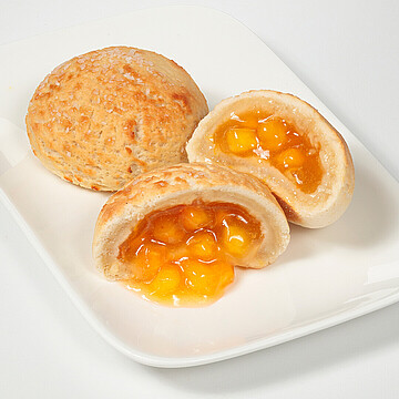 Delicious golden pastries filled with sweet fruit, perfect for brunch or a snack.