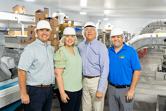 Team at Wawona Frozen Foods processing facility ensuring safety and quality in food production.