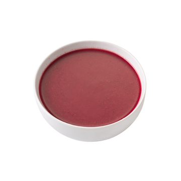 Rich red soup in a minimalist white bowl, perfect for any dining occasion.