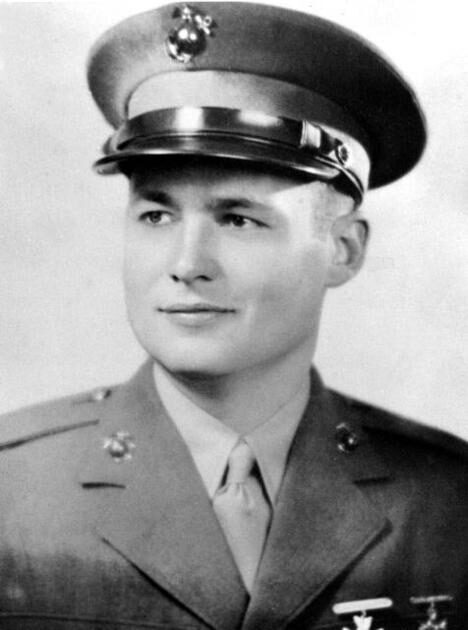 Confident young man in military uniform, showcasing pride and dedication in service.